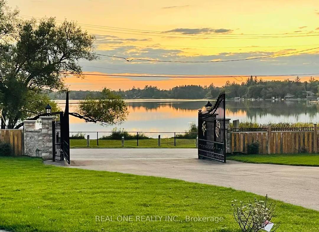 Beautifully Fully Professional Renovated Custom Built Bungalow With Direct Westerly Lake Views.