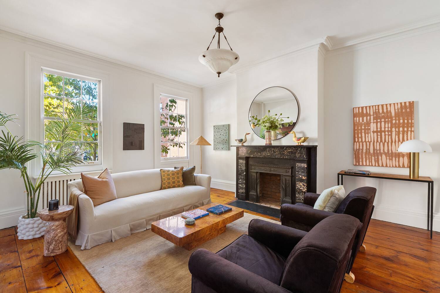 Enjoy country ambiance in the heart of the city in this lovely six bedroom, three and a half bathroom legal two family townhouse featuring stunning original details, three fireplaces, a ...
