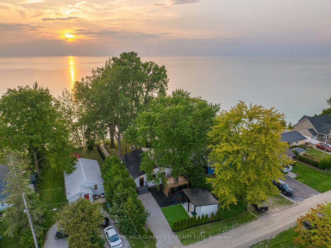 STUNNING LAKEFRONT COTTAGE COMPLETELY REBUILT IN 2023, CONVENIENTLY NESTLED BETWEEN GRAND BEND AND BAYFIELD, TURN KEY PARADISE AWAITS !