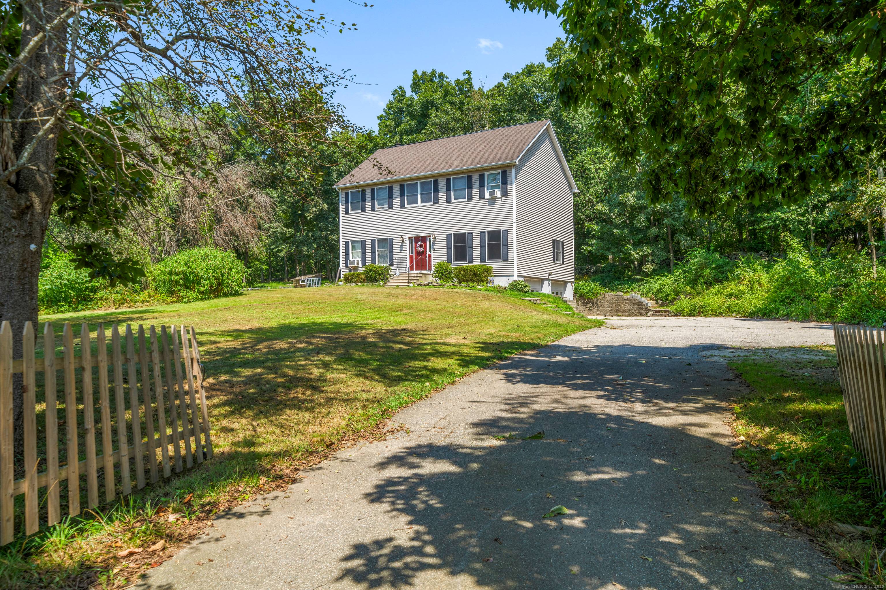 Welcome to 8 Huntington Drive, a beautifully maintained Colonial nestled in the trees in the desirable Huntington Estates neighborhood.