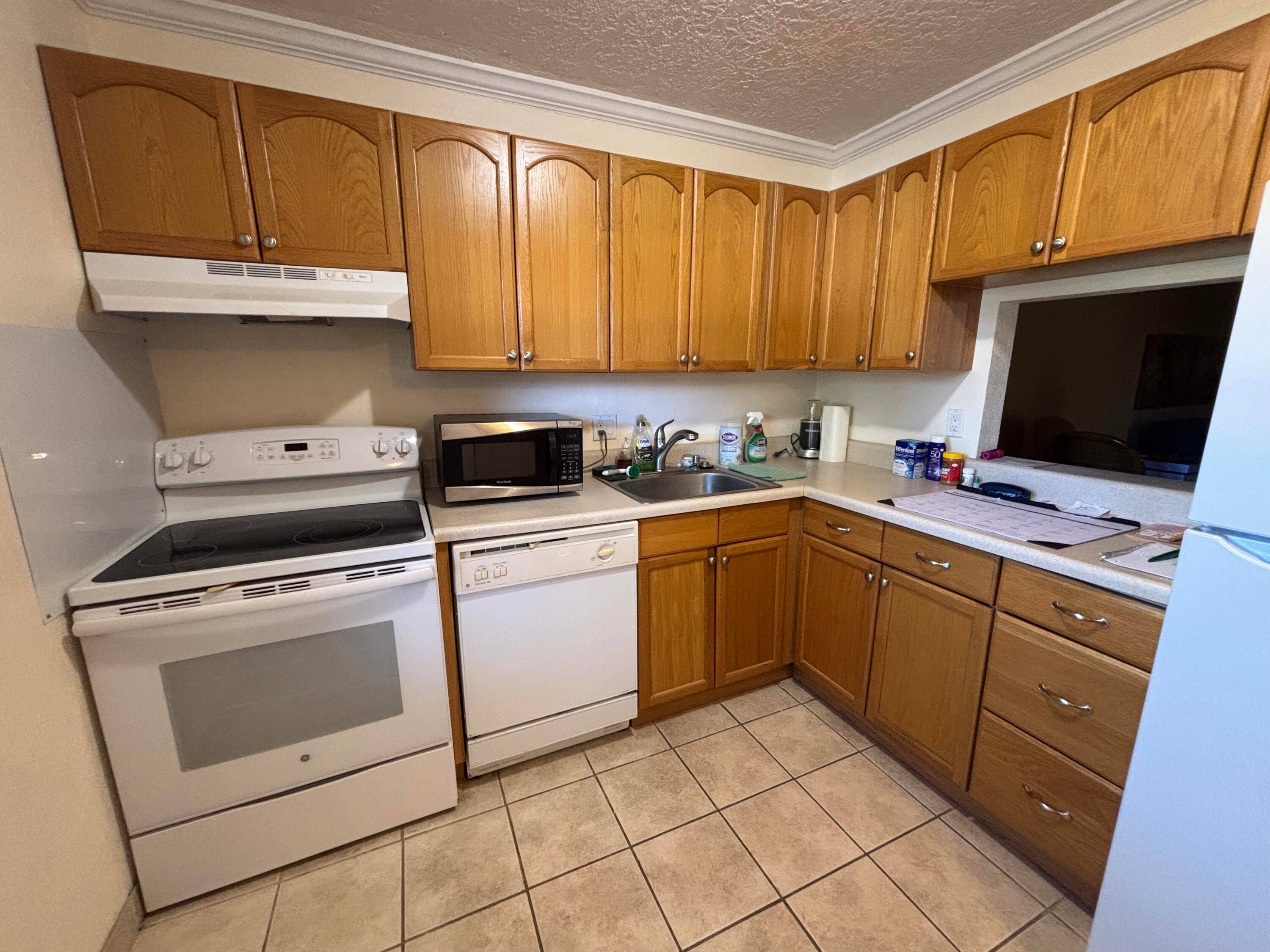 55 community. Super clean 2 2 1st floor with eat in kitchen, upgraded cabinets and separate dining room with newer air conditioner and wood vinyl flooring through out.
