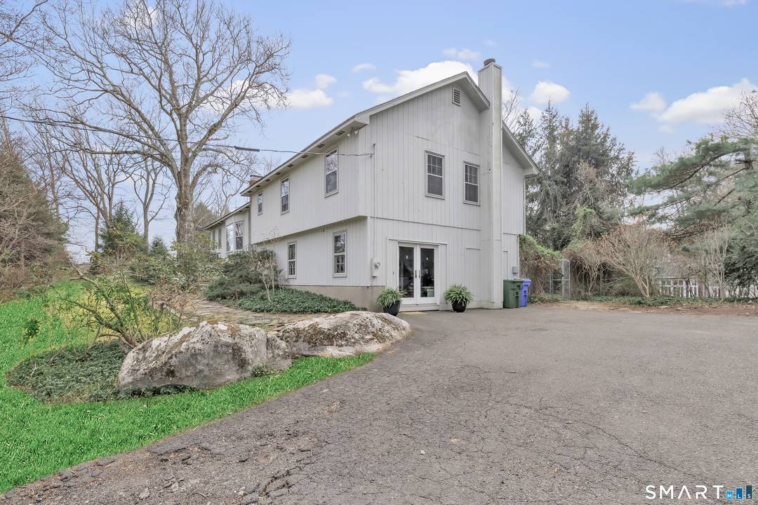 Perched at the top of a hill at the end of a shared drive, 16 Mountain Road offers a rare blend of privacy and convenience in the heart of Georgetown.