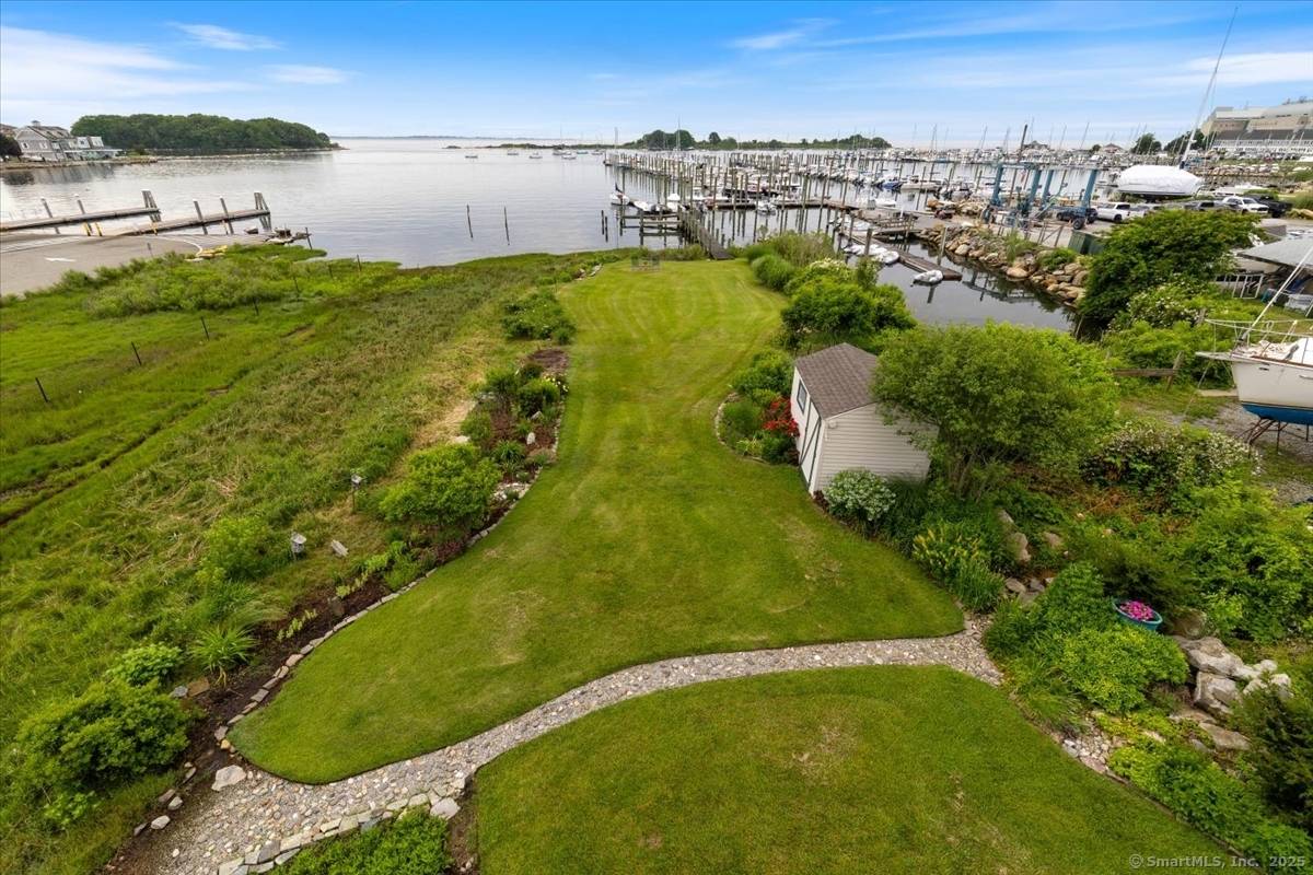 Waterfront oasis on the Connecticut shoreline with private 65 foot dock and custom built home within the sought after Shennecossett community.