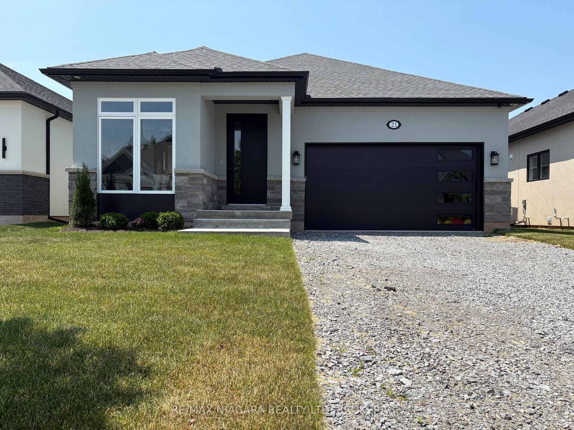 Introducing 21 Sunrise Court North, a stunning new custom bungalow designed exclusively for The Oaks at Six Mile Creek in Ridgeway, and built by Niagara's award winning Blythwood Homes.