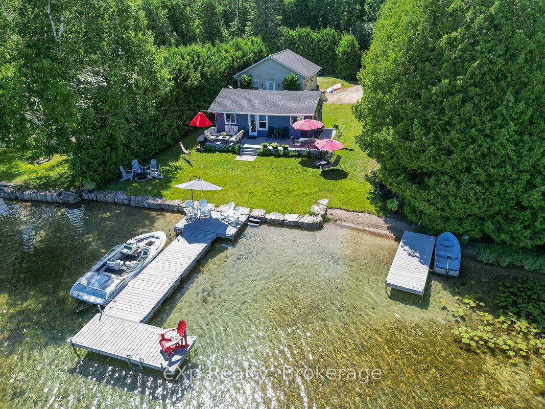 Life at the lake ! ! This delightful two bedroom cottage is set on a large lot on the shore of Williams Lake, a preferred location for summer family fun.