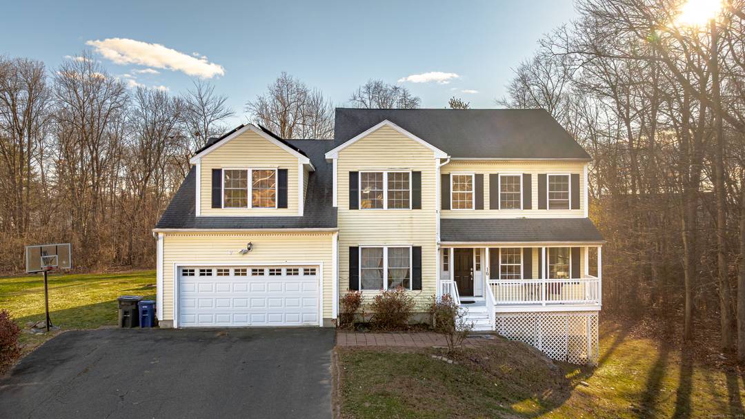 Welcome home to this spacious Colonial set at the end of a quiet cul de sac on over five private acres.