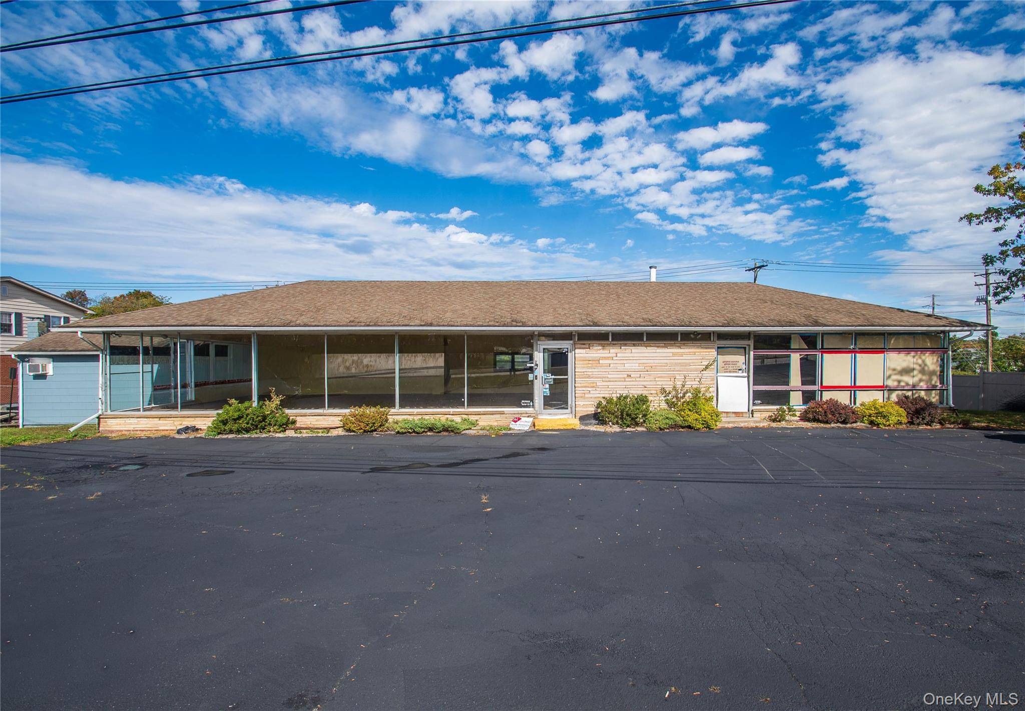 What an opportunity to OWN over 6, 000 sqft of mix use space of retail, warehouse space and grandfathered in residential space right on the Miracle Mile of Route 211 ...