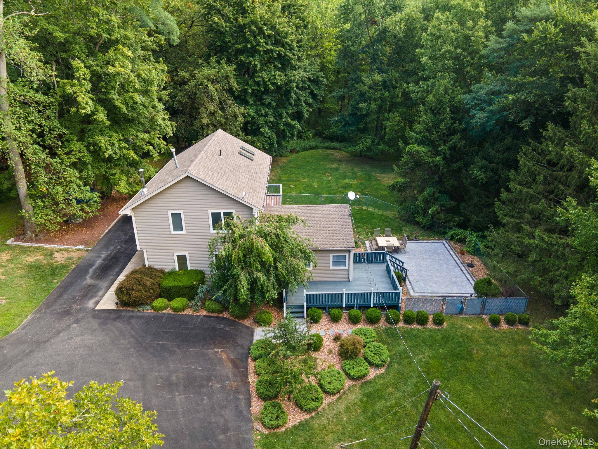 Welcome to 6 Autumn Lane, a charming Monroe retreat set on 2.