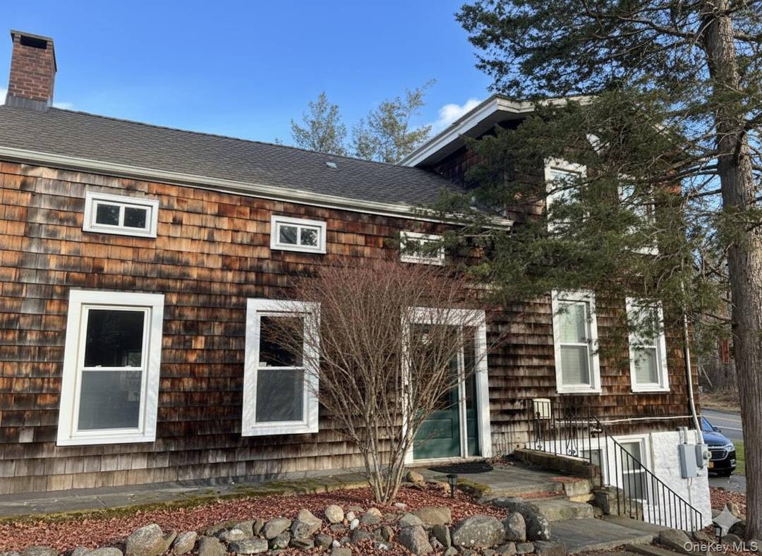 Charming Renovated Farmhouse Retreat in New City, NY Discover this one of a kind renovated farmhouse retreat, offering timeless character and modern comfort on nearly an acre of level property.