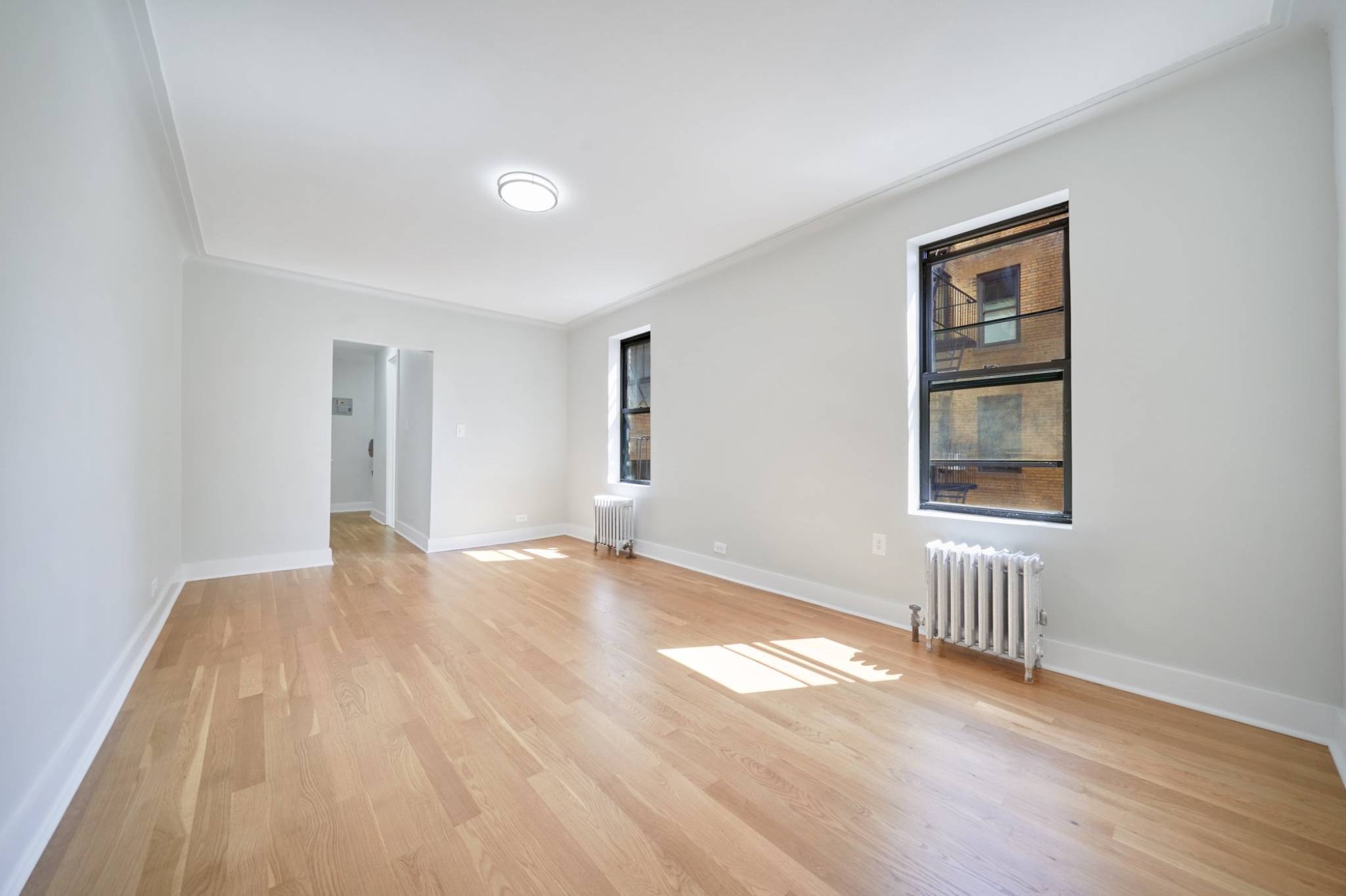 This elegantly renovated 450 sq ft studio blends modern sophistication with historic charm, nestled in a Renaissance style building in Chelseas most vibrant enclave.