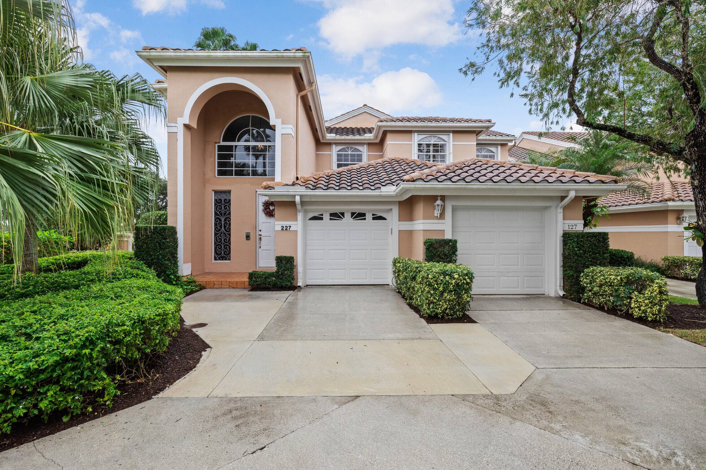 Welcome yourself home to this Exquisite corner, two story Townhouse in the sought after community of Legends in the heart of PGA National.