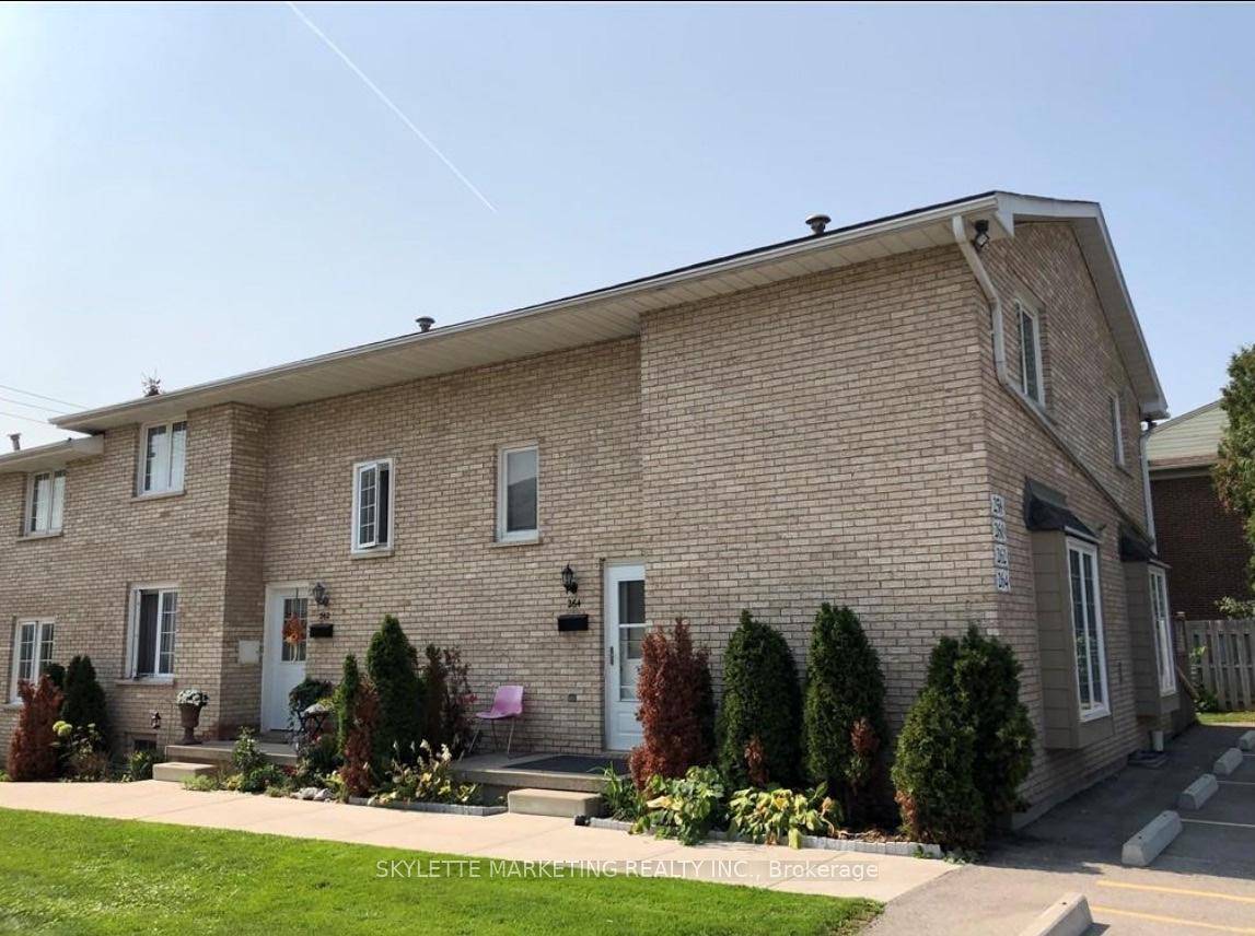 Exceptional well dressed end unit with an abundance of extra windows on a quiet location in the complex at White Hills.