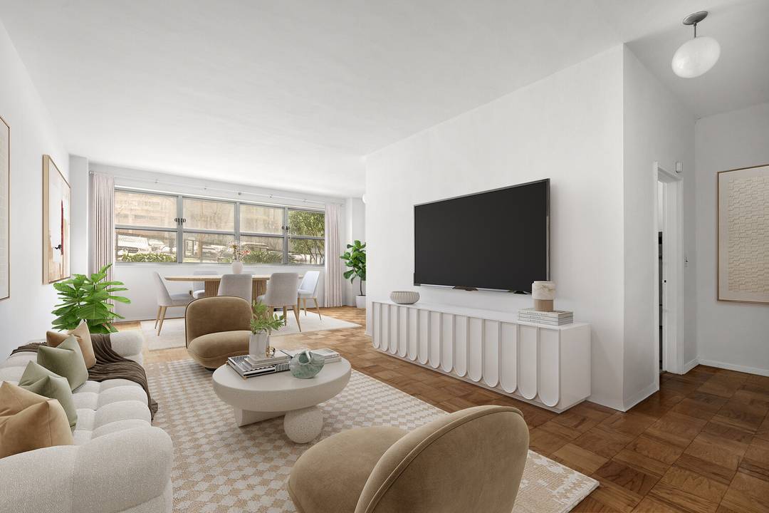 This exceptionally spacious two bedroom, two bath residence with a dining alcove offers some of the tallest ceilings in the building, creating a remarkable sense of volume and airiness throughout.