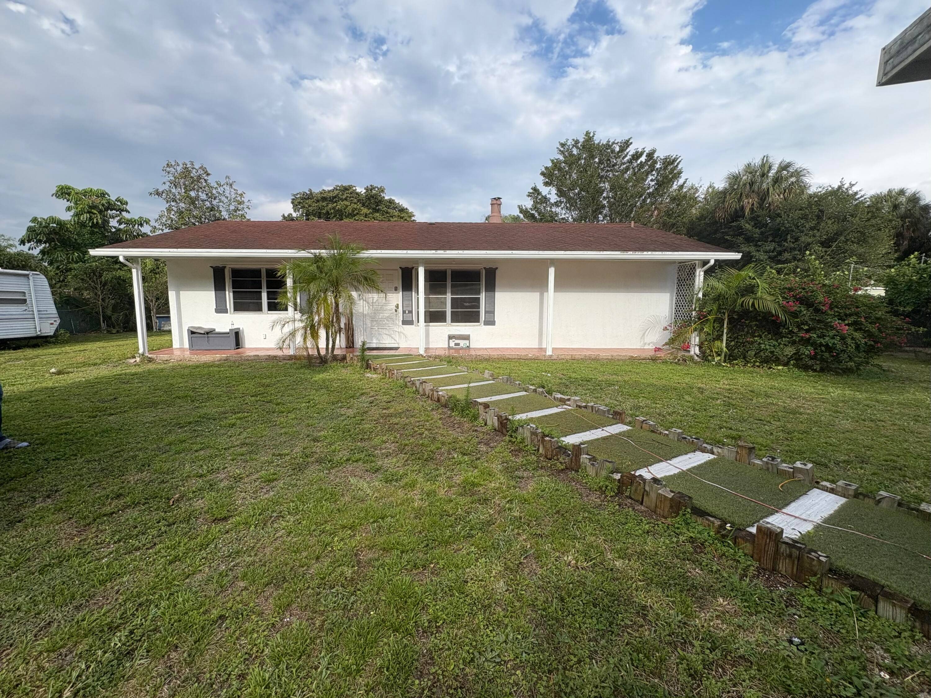 Fully Renovated Home with Expansive Land, Detached Workshop Income Producing RV !