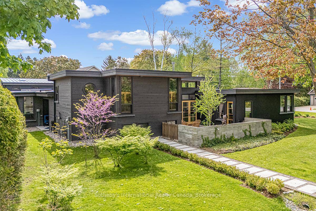 Stunning architecturally designed, 3 bedroom, 3 bath custom home offering over 3, 000 sq ft of refined living space on a rare double corner lot just steps from the shores ...