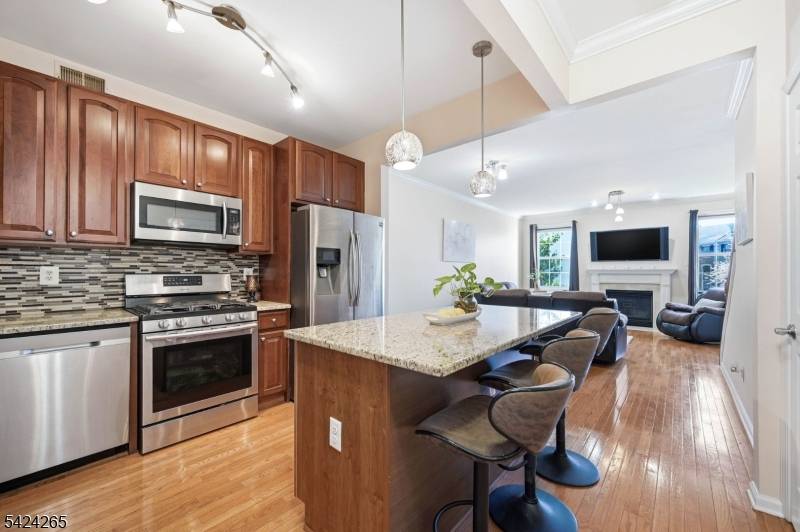 Located in sought after Cambridge Heights at Nutley, this spacious townhome offers over 2, 000 sq ft of sun filled living space, 3.