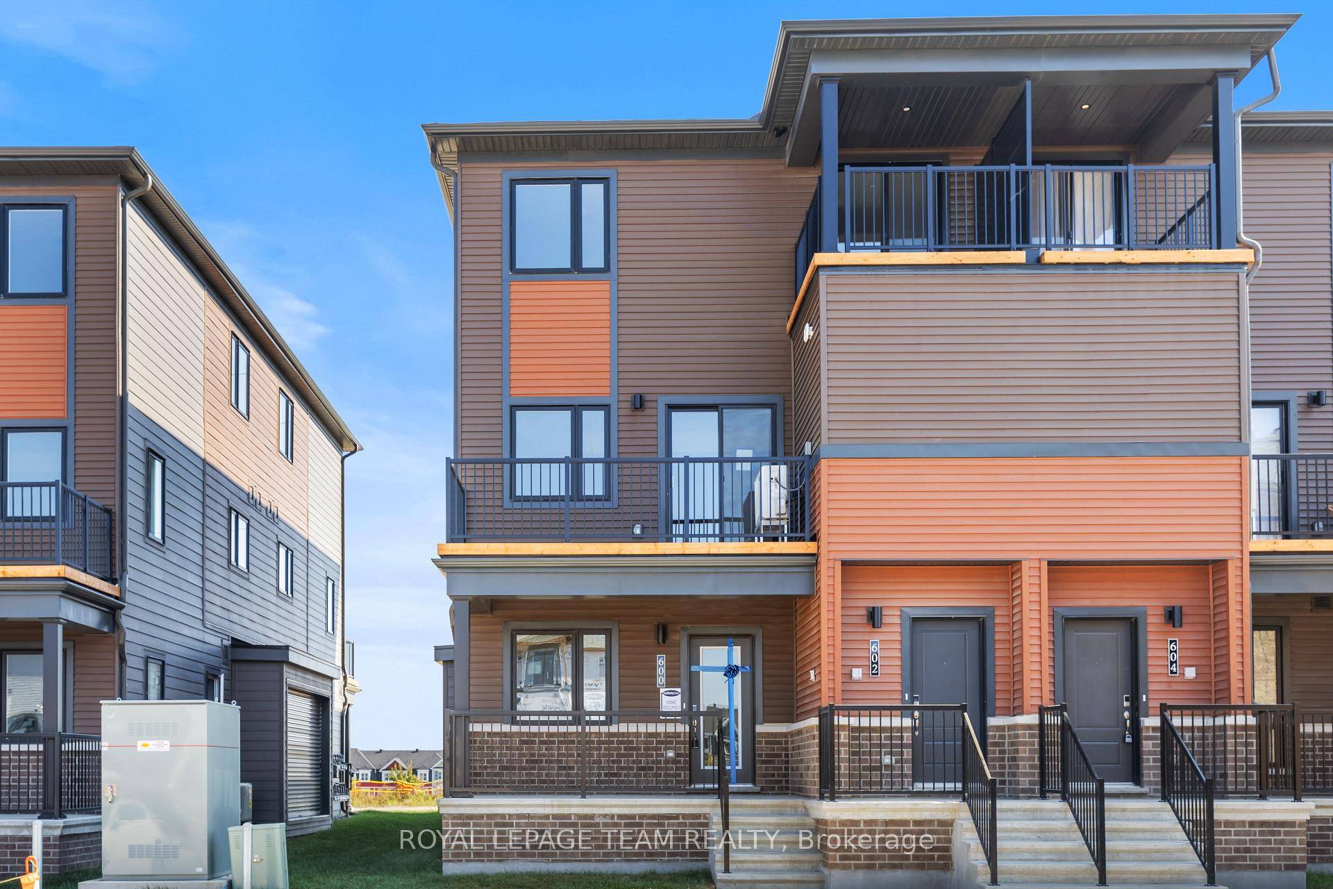 Ground level, brand new 3 bedroom, 2 bathroom stacked townhome with over 2, 150 SQFT of living space, boasting extensive upgrades in the highly sought after Half Moon Bay neighborhood ...