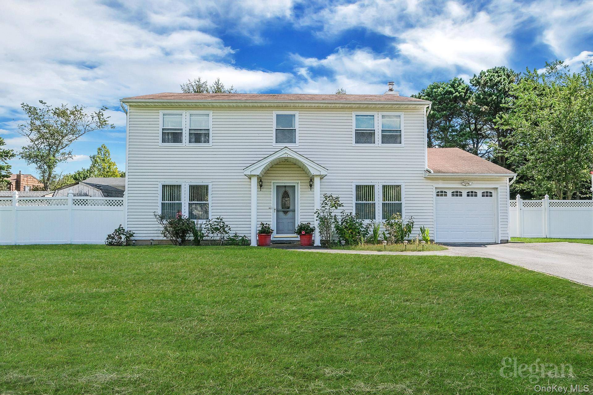 Welcome to 21 Apple Blossom Lane a residence that seamlessly combines timeless charm, modern updates, and everyday comfort in the heart of East Patchogue.