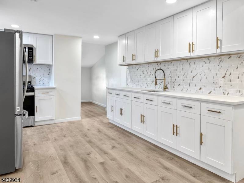 Welcome to this beautifully renovated two family home !