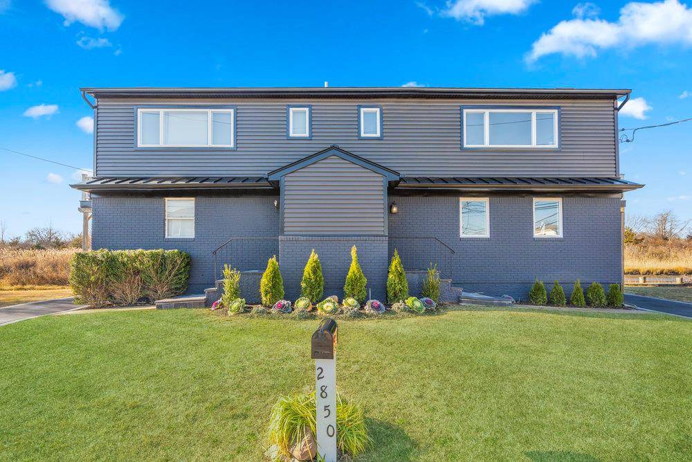 Welcome to this unique waterfront duplex style legal two family home in South Seaford.