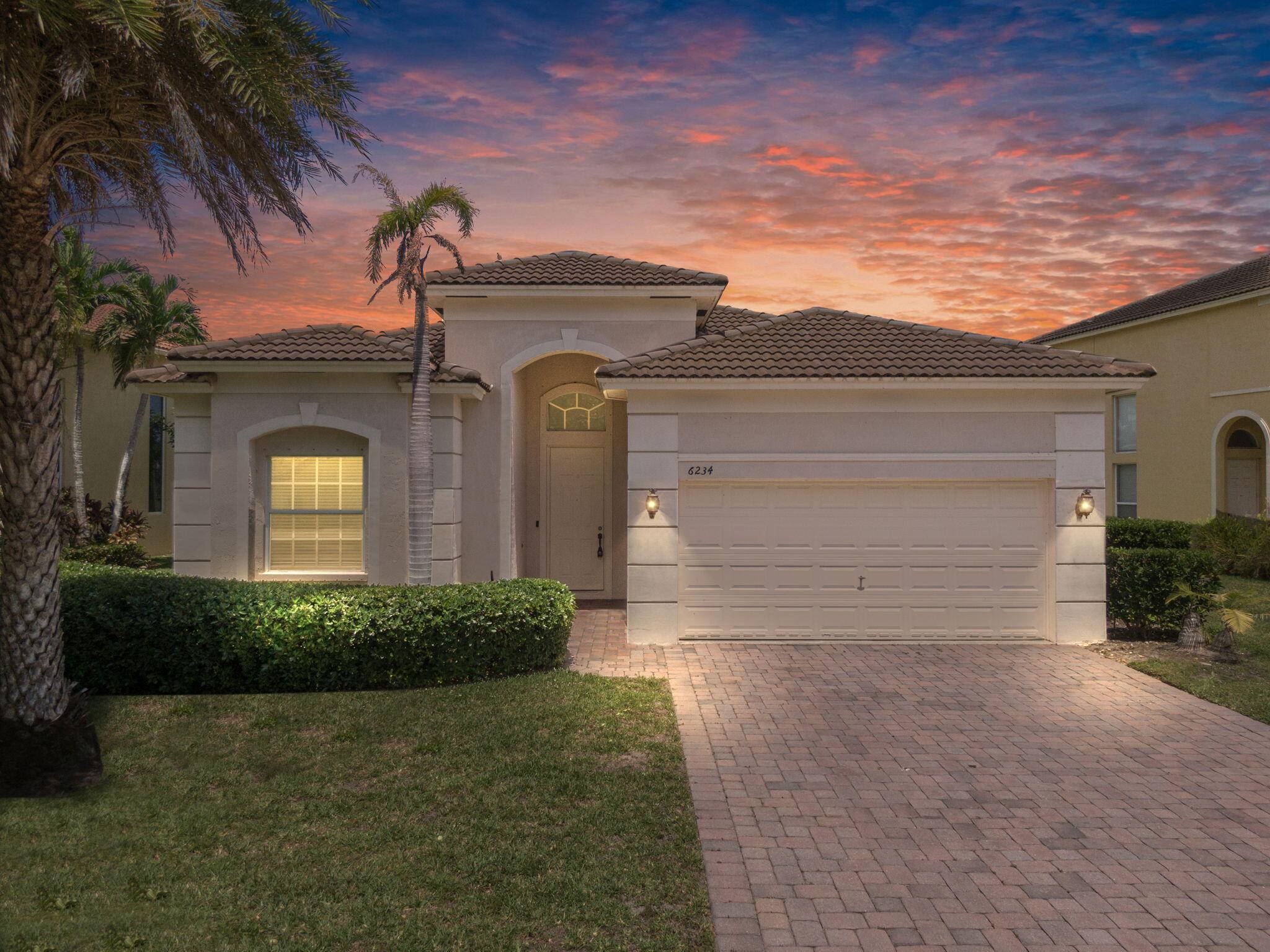 Impressive waterfront home on oversized lot located in the distinguished Portofino Shores community !