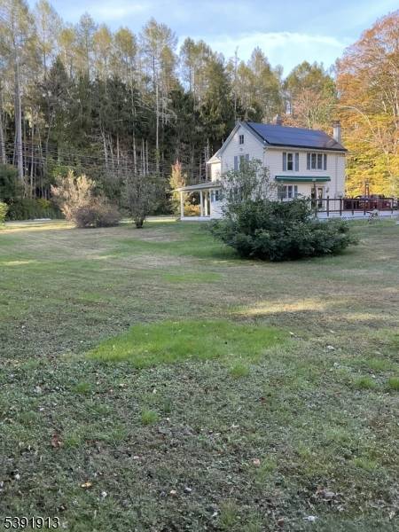 House also has solar panels on back of the house roof and a power retractable awning on deck