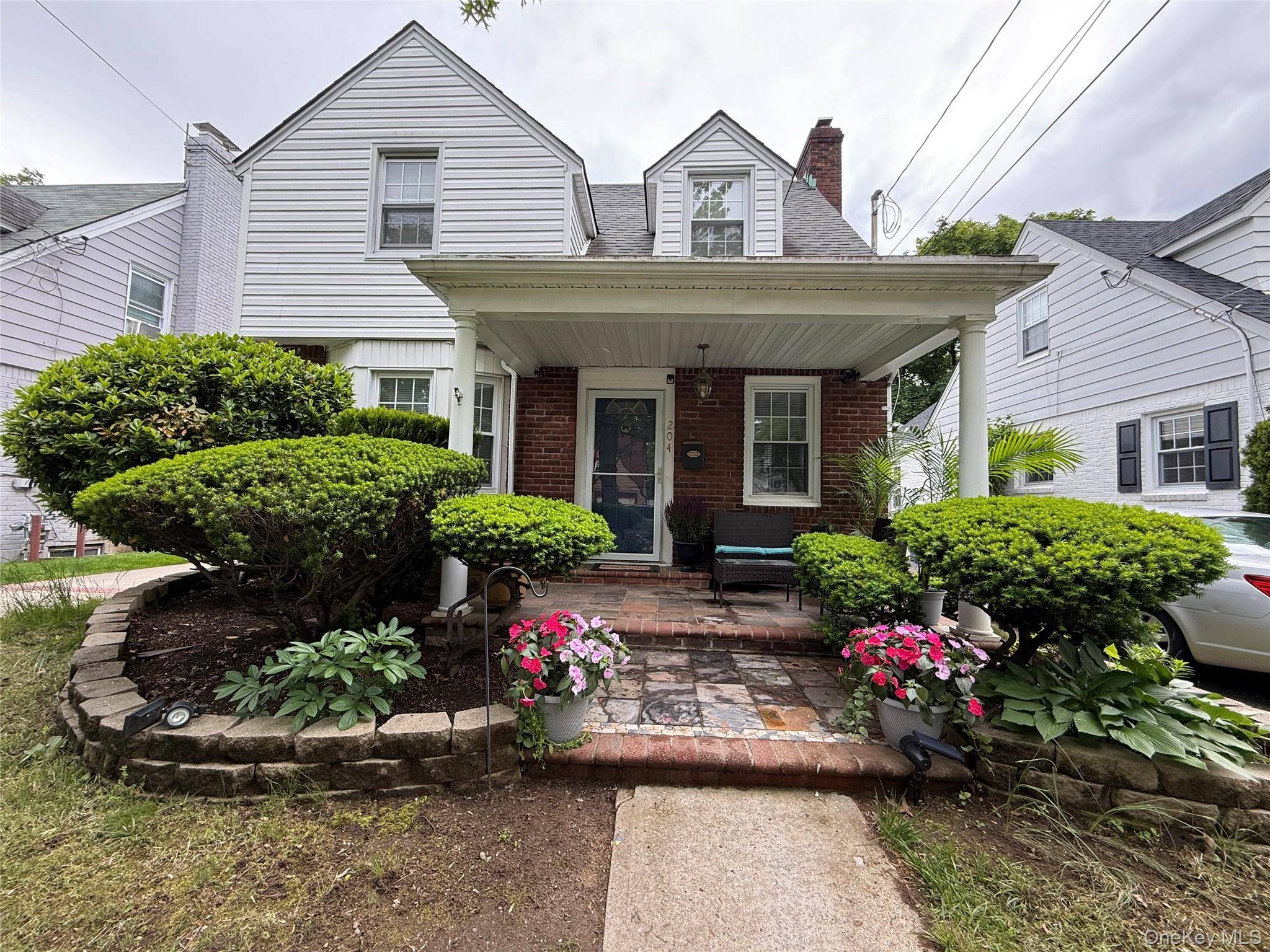 Renovated Colonial Home, with front porch and timeless style.