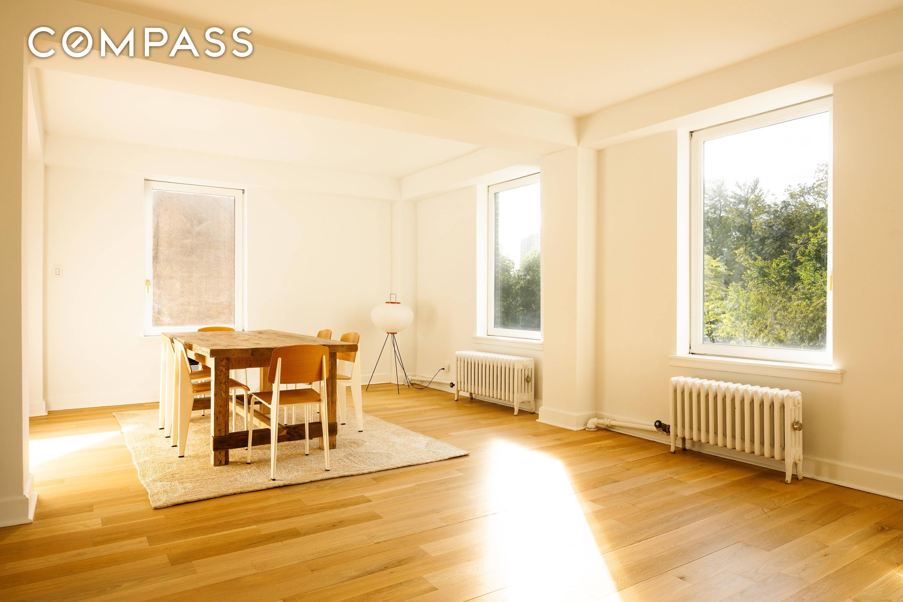 Serenity abounds in this dreamy, sun drenched, newly renovated home overlooking the treetops of Tompkins Park.