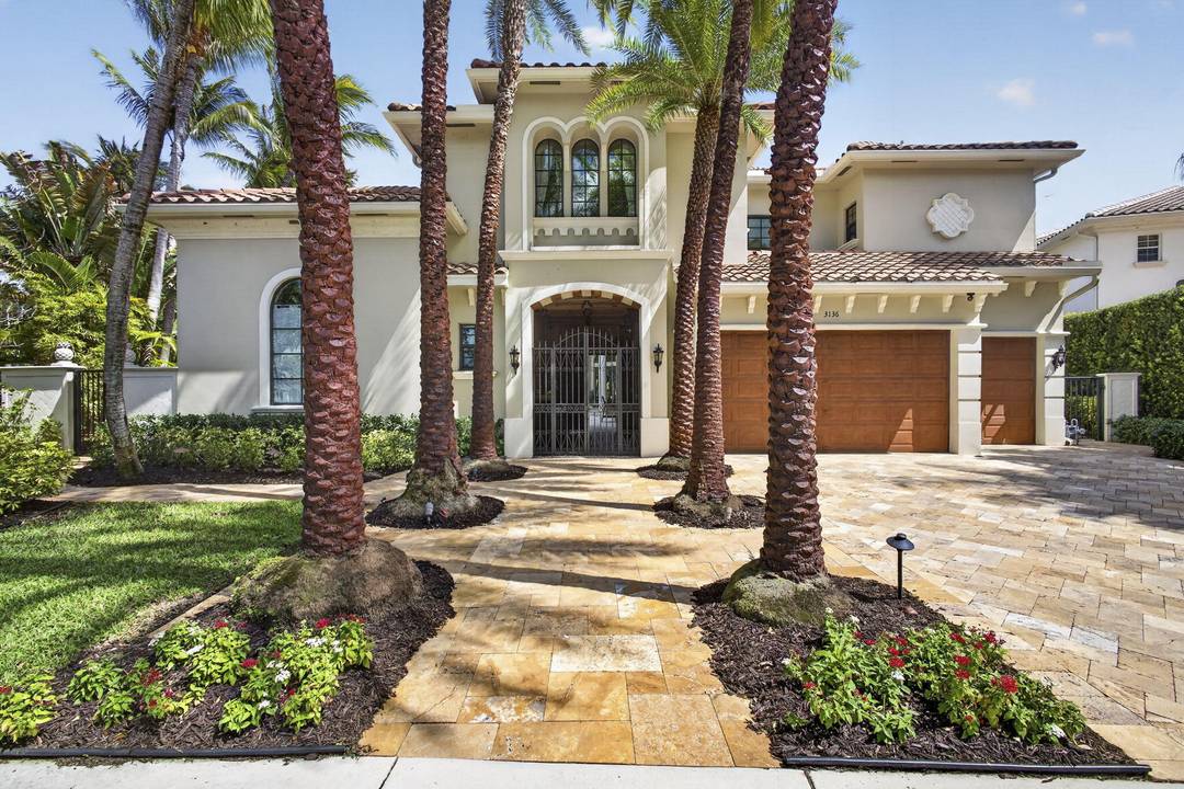 Discover this Remarkable Gem with Courtyard Pool Home with Guest House, Stunning Front and Back Lake Views, Grand Architectural Details, High Ceilings, Marble Flooring, Family Room with Custom Stone Fireplace, ...