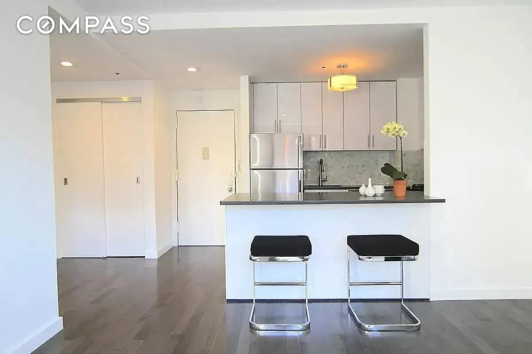 Meticulously designed, light filled, gut renovated 1 bedroom condo apartment in the center of the booming East Village.