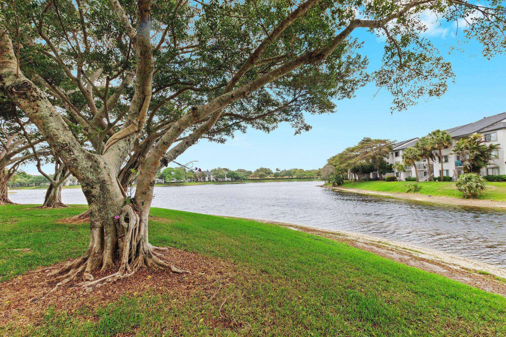 Escape to your own tropical retreat in this spacious 2 bed, 2 bath condo with stunning lake views and unforgettable sunsets.