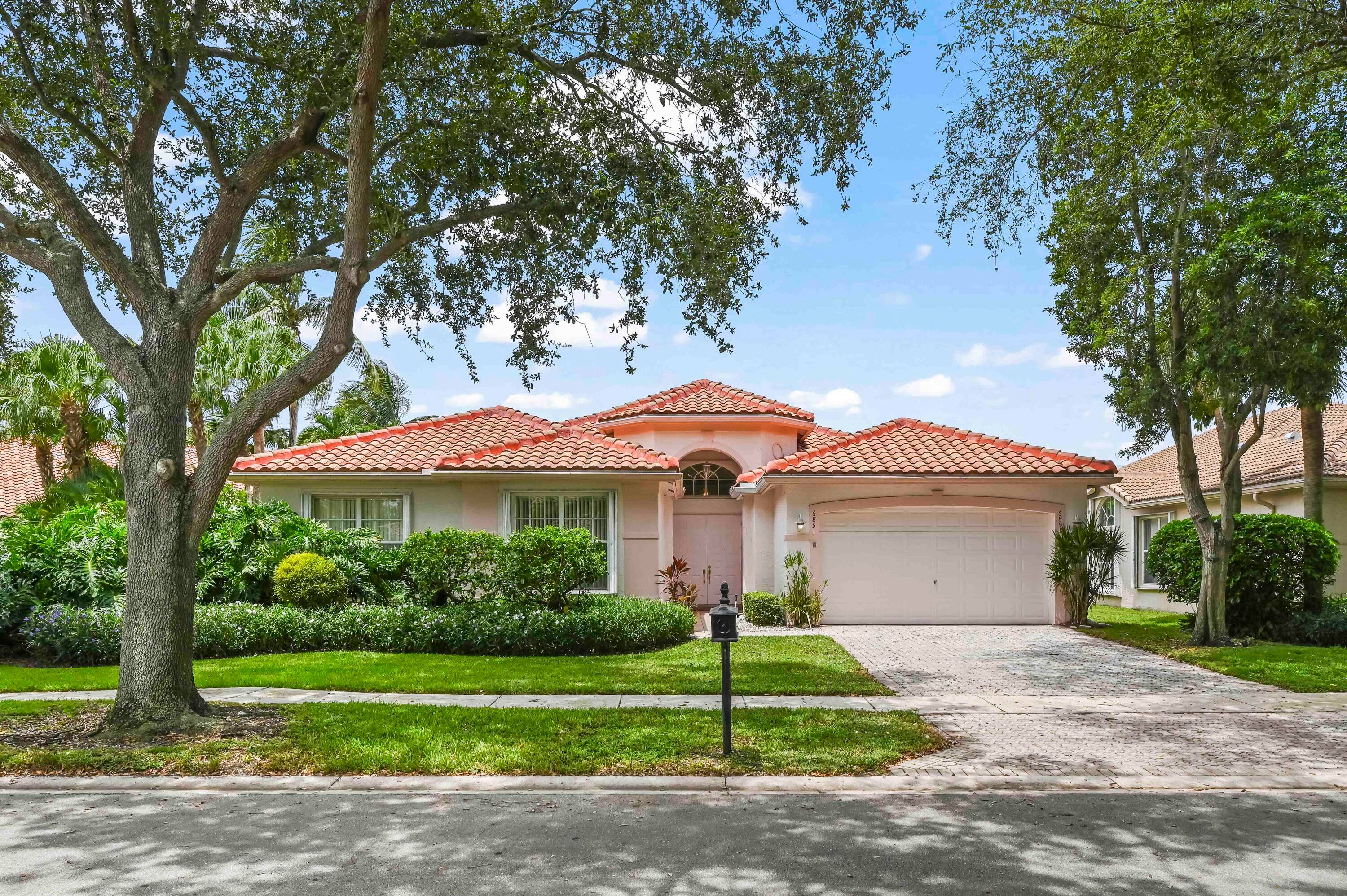 NEW ROOF 2023Presenting 6851 Fiji Circle, a marvelous haven of sumptuous living in the highly sought after Valencia Isles Community of Boynton Beach, Florida.