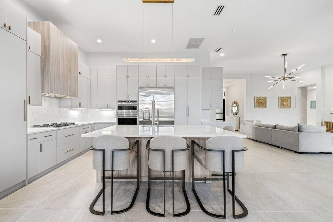 2026 Renovation Mirabella Community Kenco Built Modified Rossello Model Lakefront 1 Story 12ft Ceilings 4 Bedrooms 3 Bathroom New Kitchen with Euro Style Cabinets GE Cafe Appliances 48 inch Fridge ...