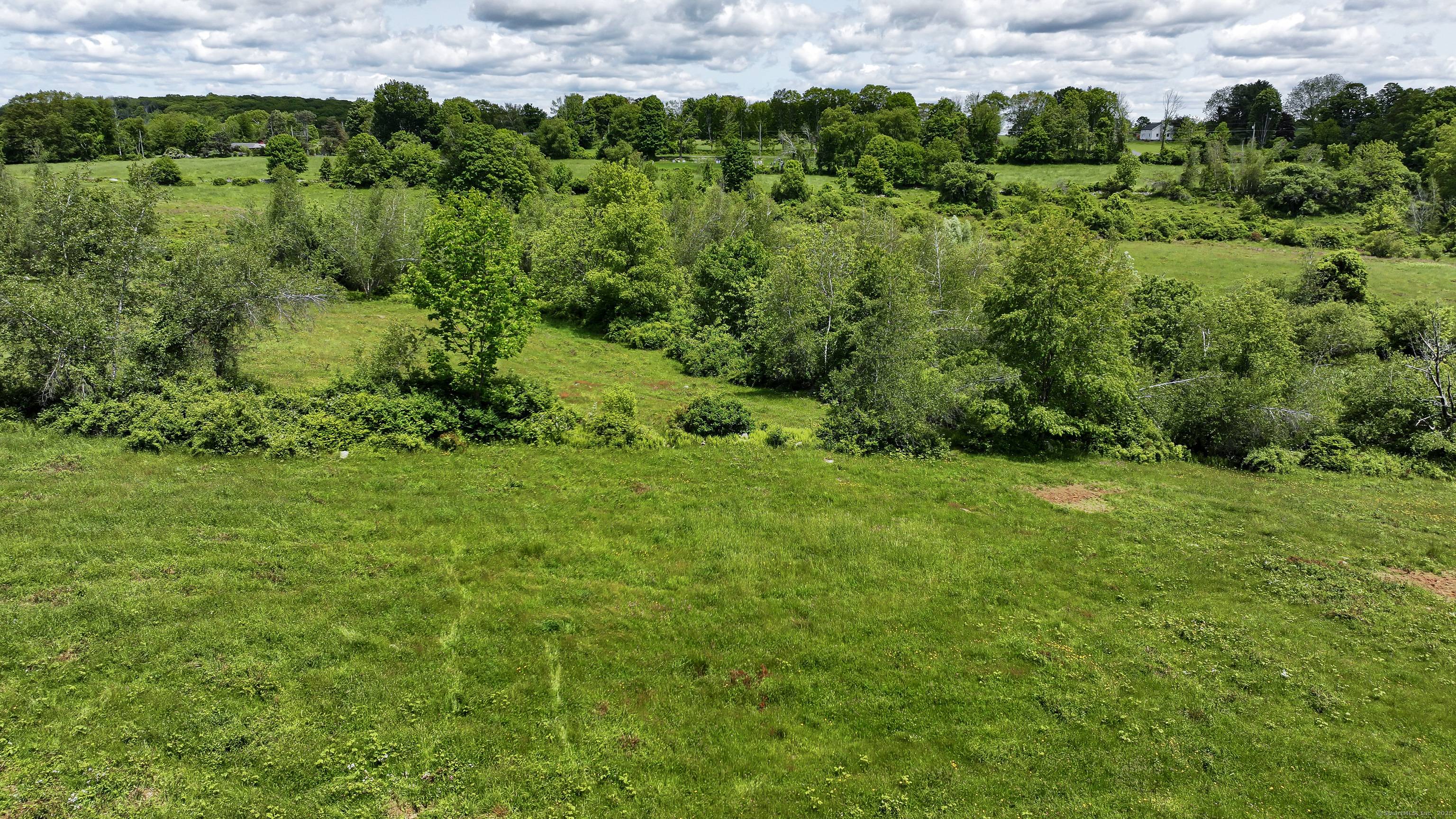 Set At the Intersection of 2 Bucolic Low Traveled Roads, this 25 Acre Pastoral Parcel Offers Total Privacy.