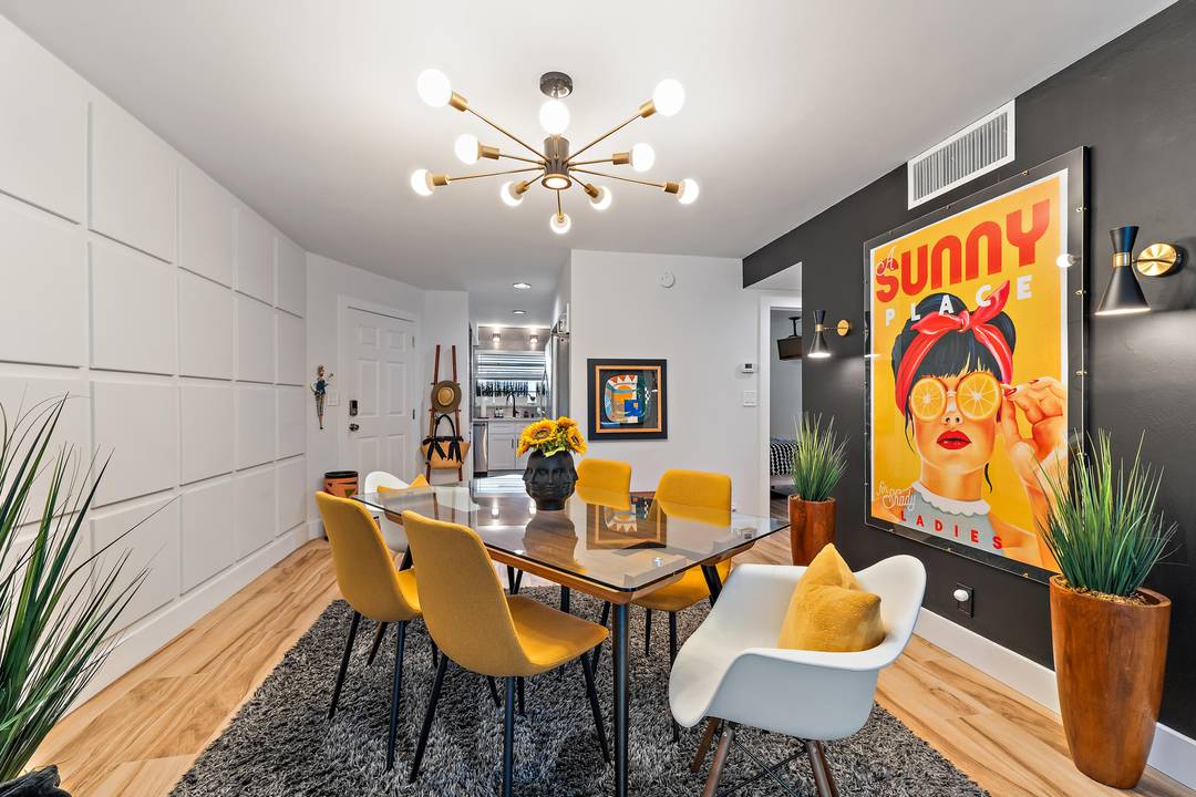 You will FALL in LOVE with this Mid Century modern top floor unit !
