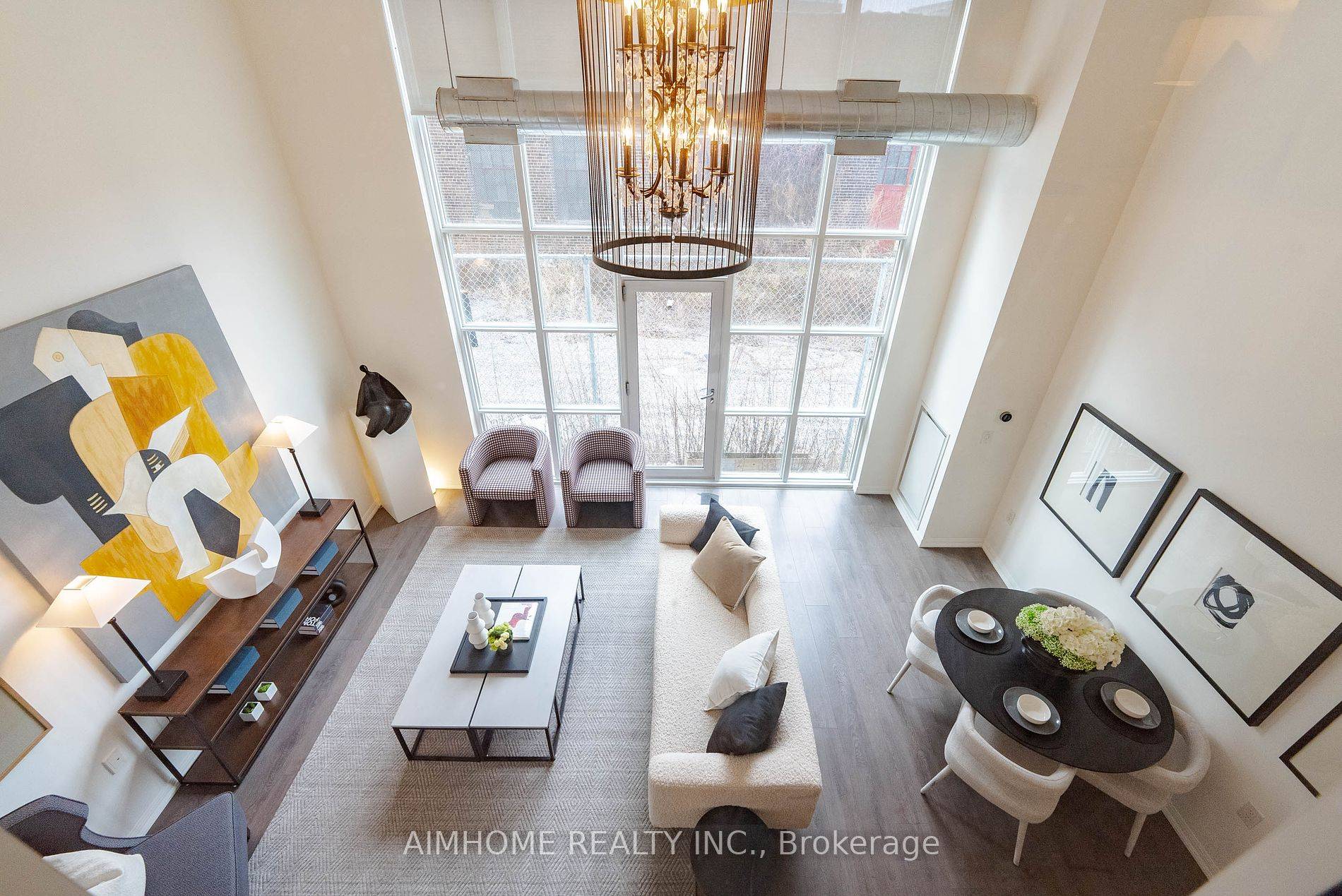 This luxury loft style condo townhouse in trendy Liberty Village offers a blend of modern aesthetics and convenience.
