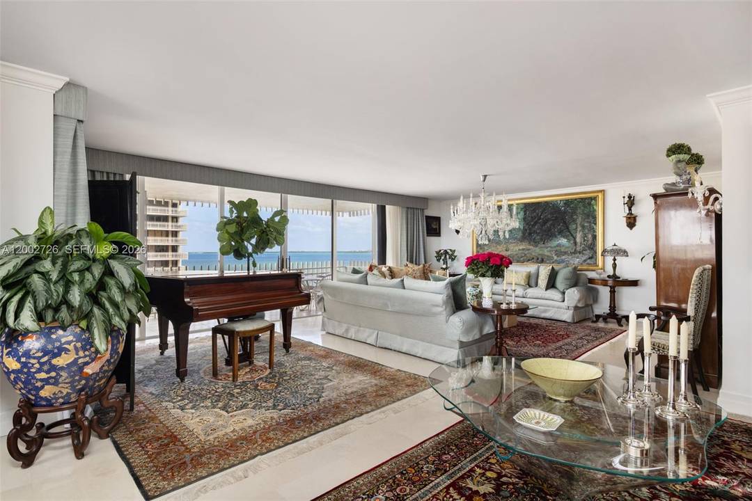 A rare offering in the coveted 09 line at Grove Isle, this beautifully updated 3 bedroom, 2.