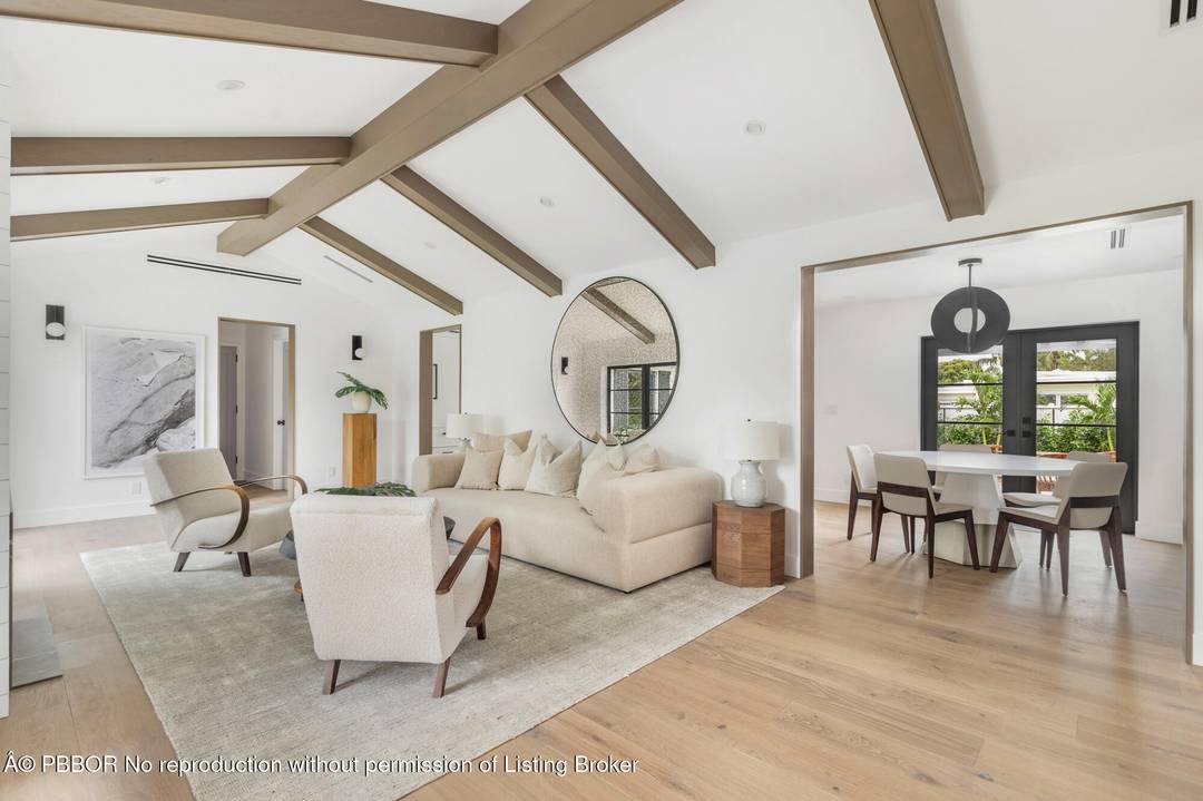 Completely reimagined, expanded, and masterfully renovated, this concrete block residence offers 3 bedrooms and 2 baths across nearly 2, 800 sq ft of light filled living.