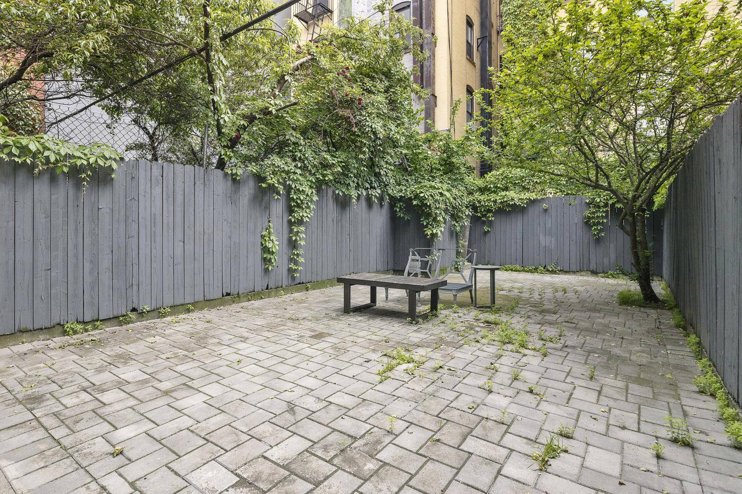 A 3 family brownstone with warmth, character, and smart design choices throughout !
