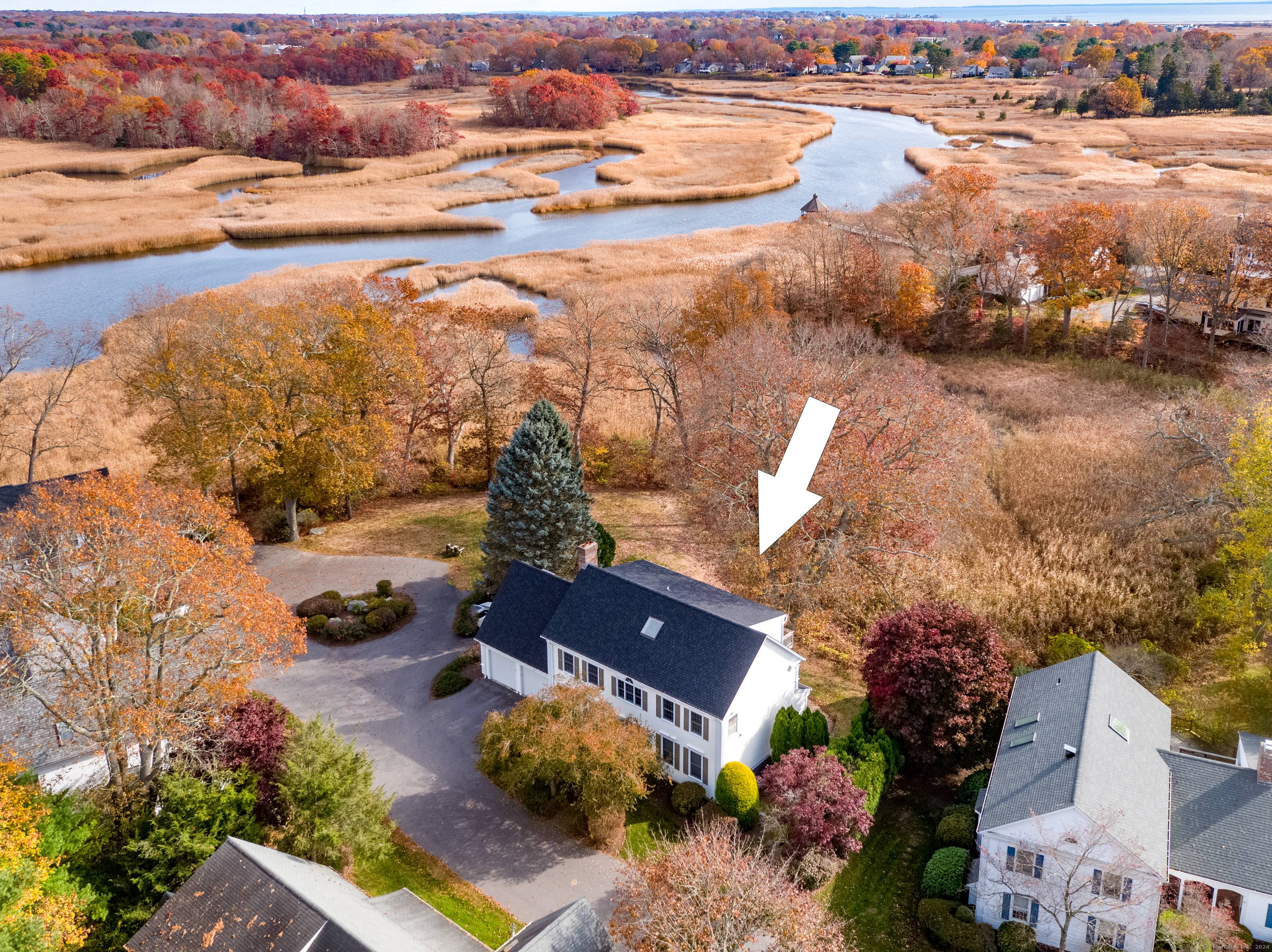 Privately sited at the end of Longview Terrace with expansive marsh and river views this larger than most free standing colonial at over 3700 sf offers luxurious condo living.