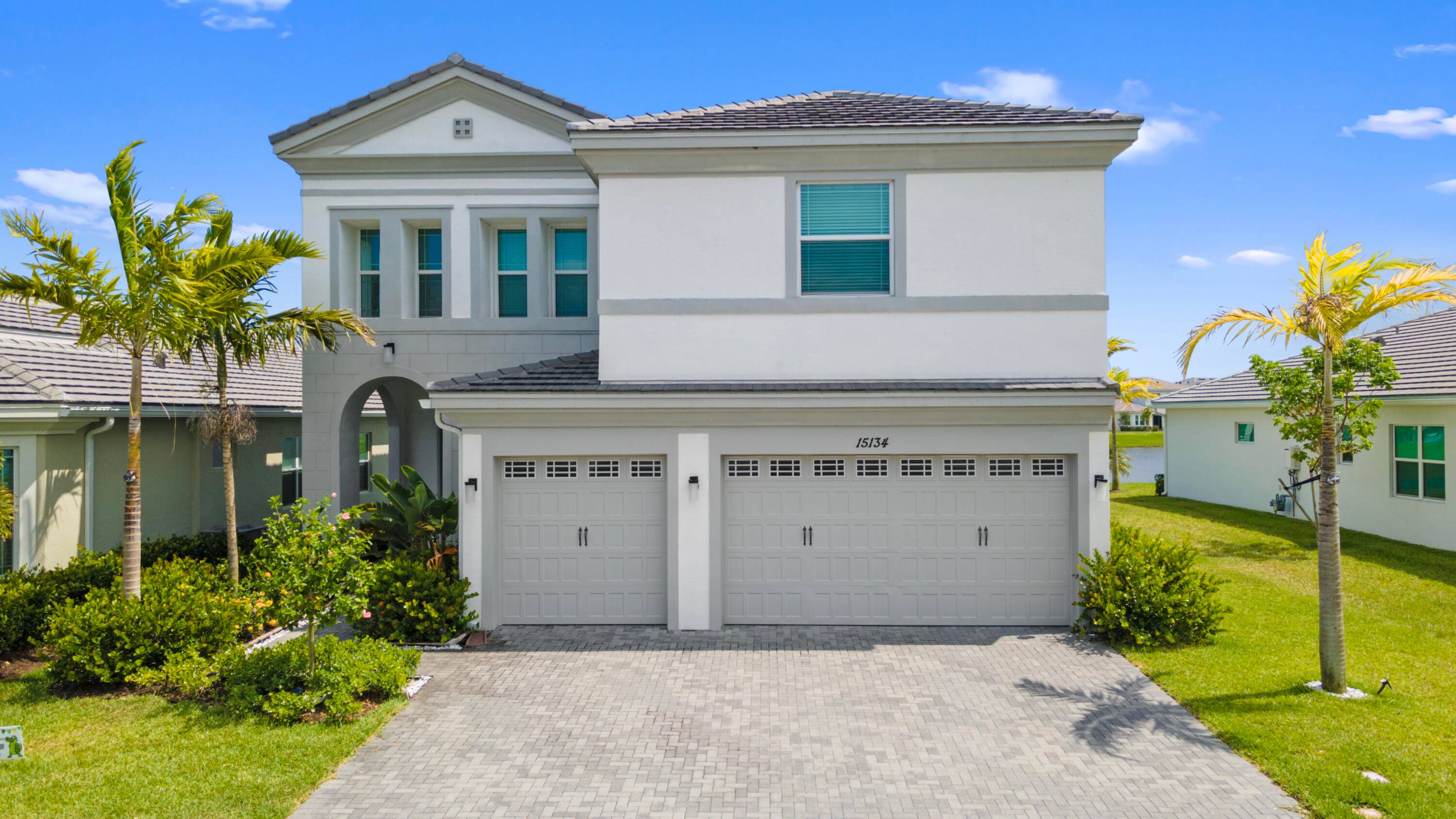 Enjoy breathtaking lake views in this exceptional home, where natural light and refreshing airflow fill every space.