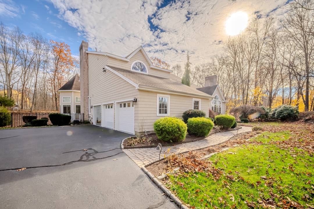 Located on a serene cul de sac in desirable Orange, this beautifully designed 4 bedroom, 3.