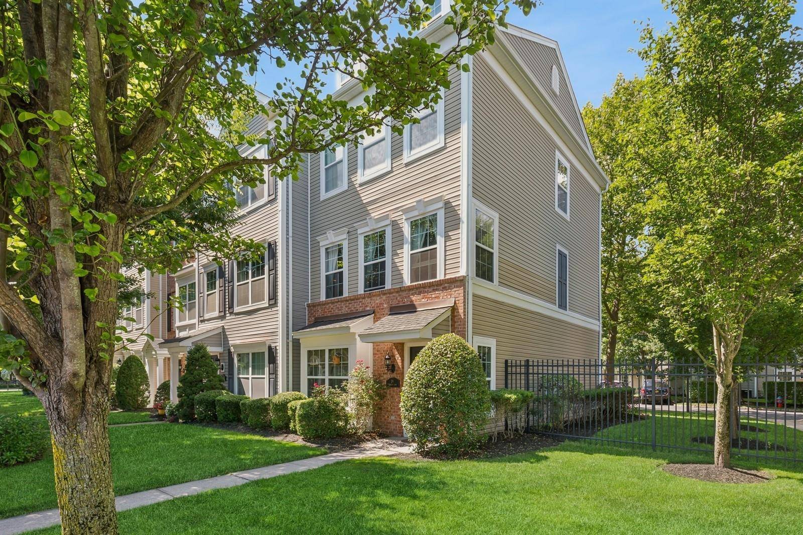 Embrace easy living in this immaculate three story townhouse nestled in the heart of Patchogue Village !