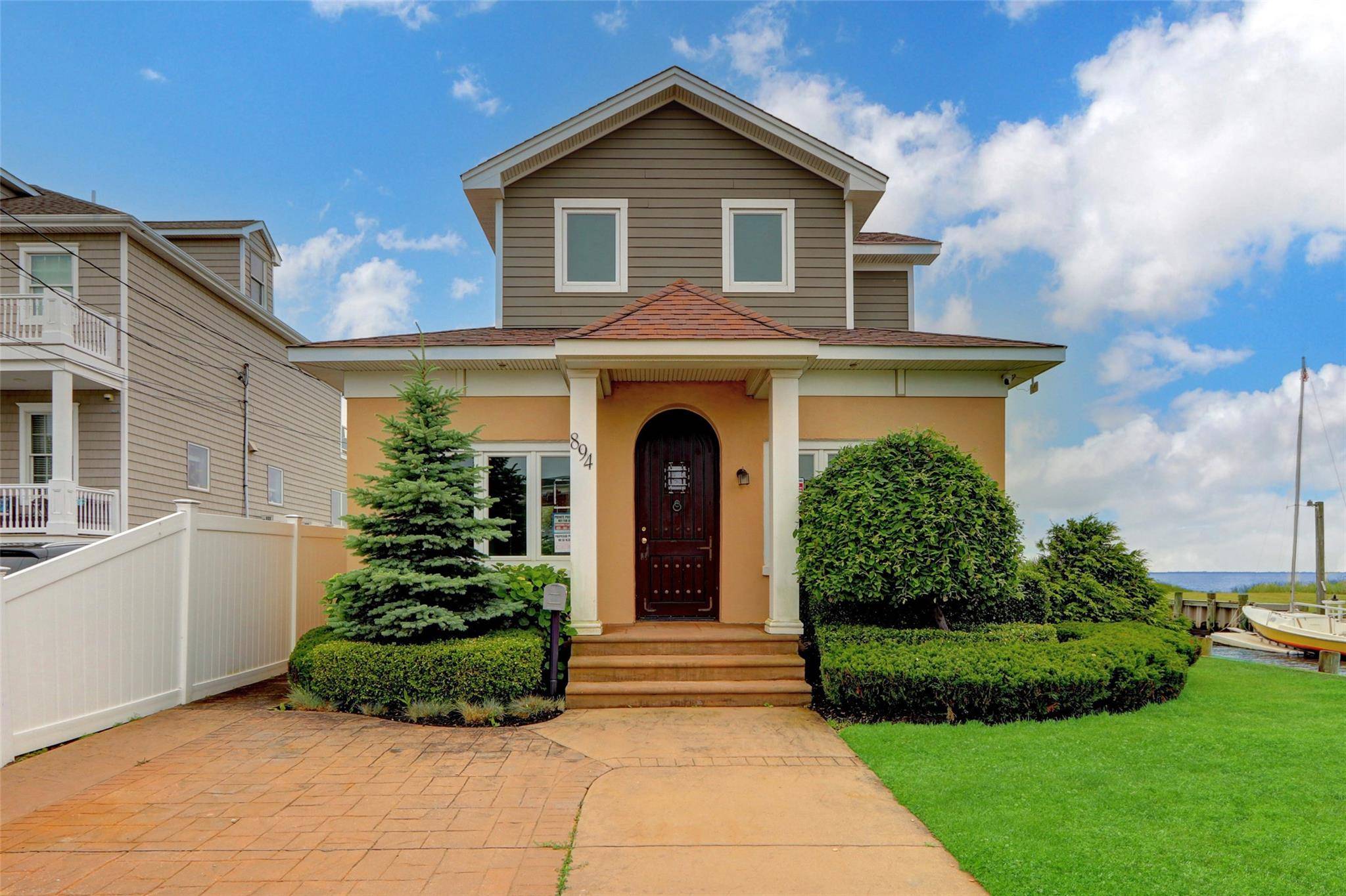 Outstanding 2 Story beauty with breathtaking views of the open bay, located on a dead end street, enjoying a versatile layout and exceptional potential.