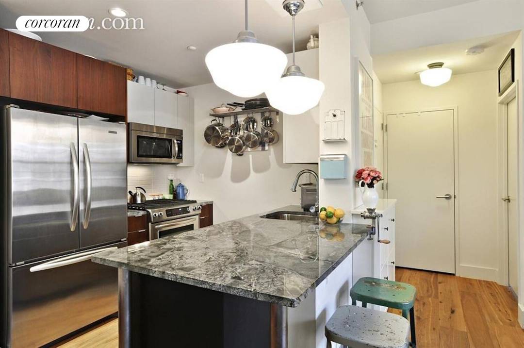 Welcome to this well appointed two bedroom, two bath residence at Columbia Commons Condominium in Cobble Hill's Columbia Street Waterfront District.