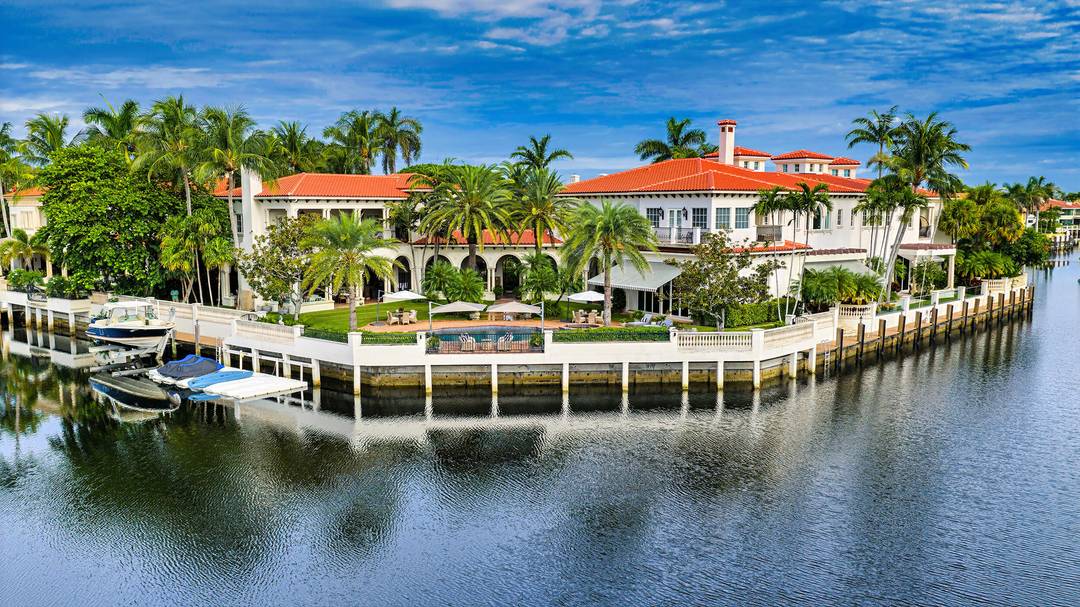 Palatial Palm Beach inspired Sanctuary masterpiece originally built by Dan Swanson of Addison Development, with stately main house and separate guest carriage house on 2 trophy southeast point lots surrounded ...