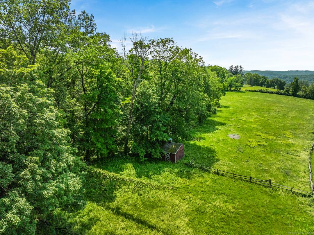 68 acres consisting of two lots in the hills above Lake Waramaug with potential for long views and a glimpse of the lake.