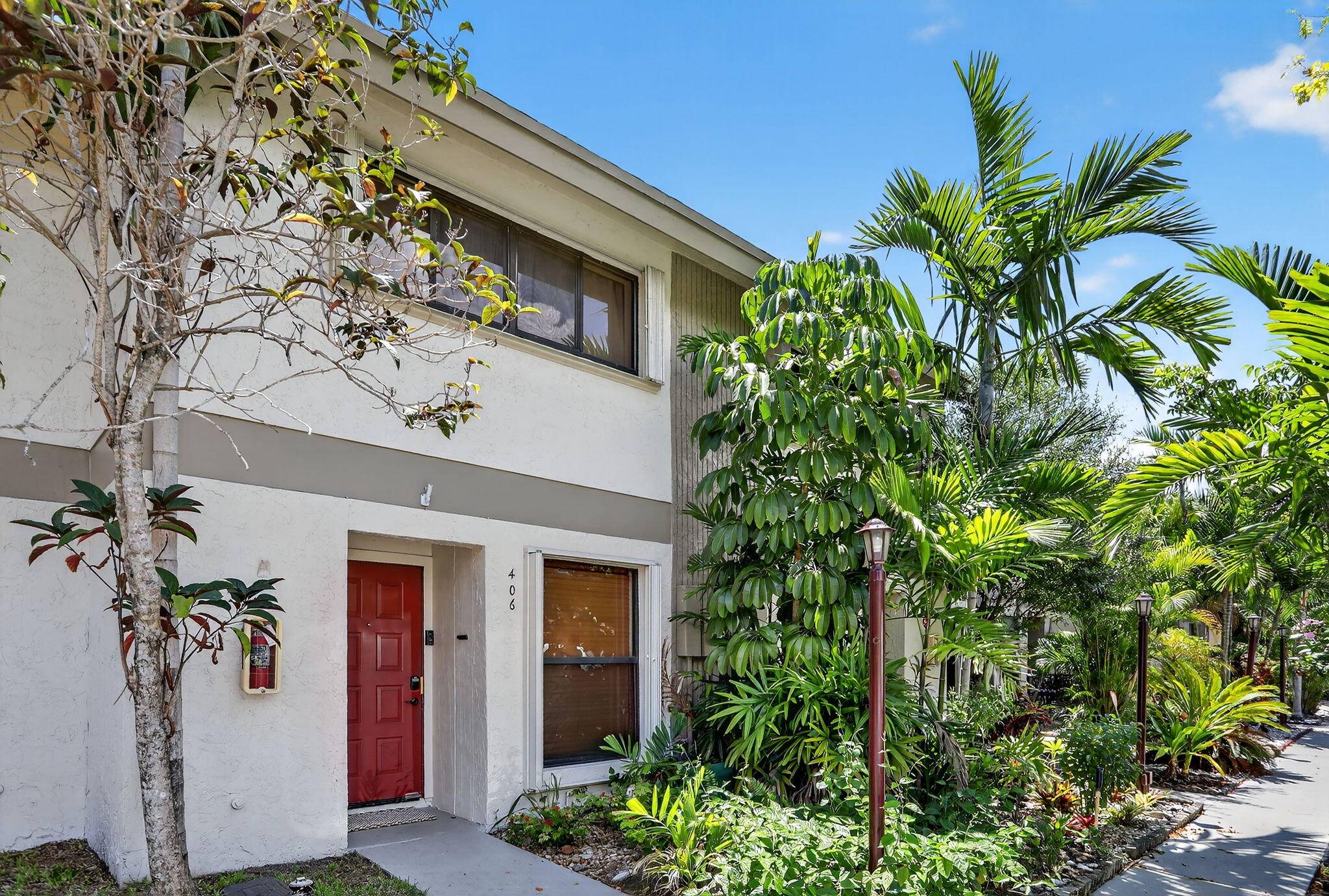 This inviting 2 bedroom townhome is nestled in the gated Pines West community.