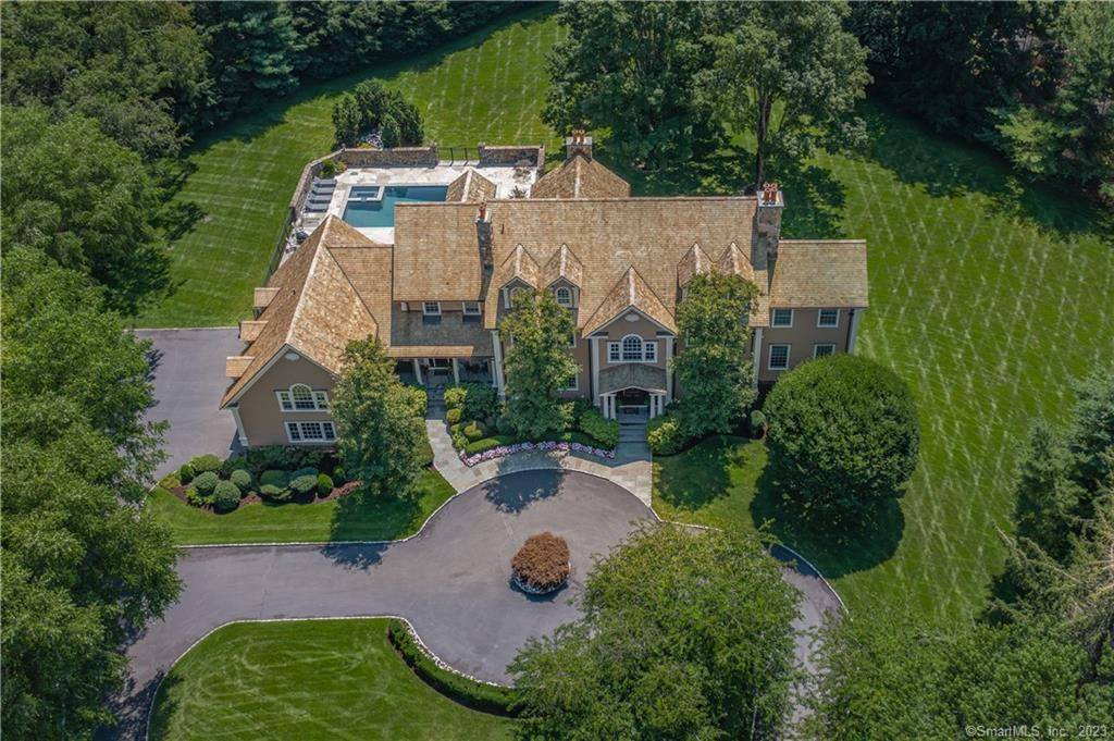 Refined living awaits on Boxwood Lane, a prime Hunt Club cul de sac featuring tranquil private entrances to stately colonial style homes.