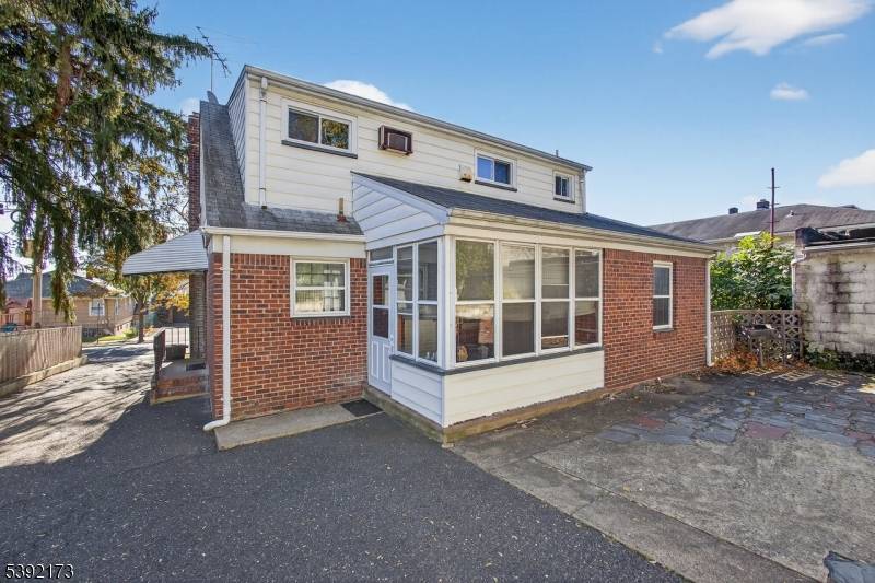 HOTTEST 2 Family home on the Market offering 4 Driveway Parking Spots and a 2 Car Detached Garage !